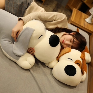 Detailed close-up of a long plush dog pillow showing soft texture and cozy home scene