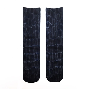 Detailed flat lay of unisex crew socks with a realistic crocodile skin pattern print