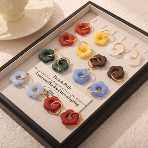 Colorful resin flower earrings set in vintage black display tray with golden metal loops