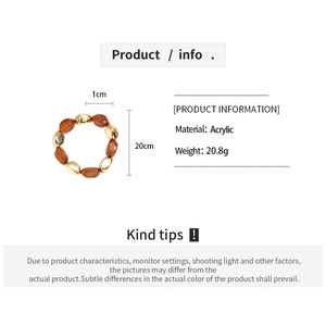 Detailed view of acrylic beads in gold and orange tones with product measurements