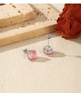 Macro view of S925 sterling silver stud earrings with pink firework-cut stones