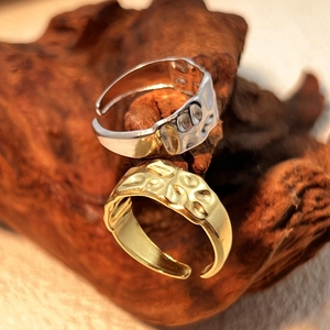 Textured 18K gold and silver stainless steel open rings with a hammered metal surface