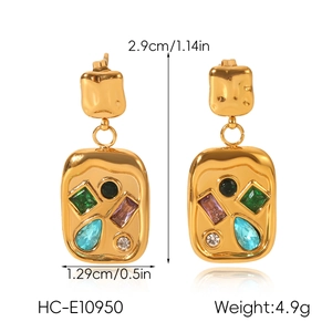 Detail view of gold-plated geometric earrings with dimensions 2.9cm by 1.29cm