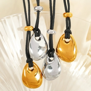 Minimalist teardrop metal pendants in gold and silver finish with black cord necklace