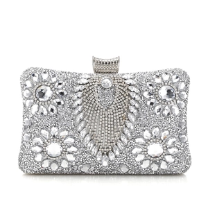 Elegant silver evening clutch bag with floral rhinestone patterns and metal clasp