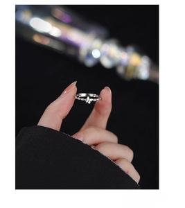Detailed view of S925 sterling silver braided ring with zircon butterfly design