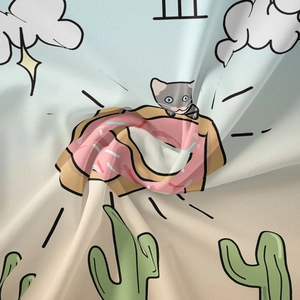 Close-up of soft polyester fabric with digital print of a cartoon cat and donut
