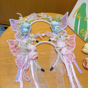 Pink and blue butterfly headbands with tulle petals, pearls and long fringe ribbons