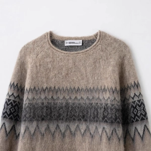 Women's light brown knit sweater with dark grey Fair Isle geometric patterns on round neck