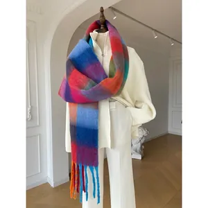 Rainbow gradient plaid thick scarf with fringes styled on a minimalist white outfit