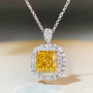 Macro detail of radiant cut yellow gemstone necklace in S925 sterling silver halo setting