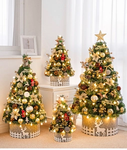 Detail of mini PVC Christmas trees with gold ornaments, LED lights and reindeer felt bases