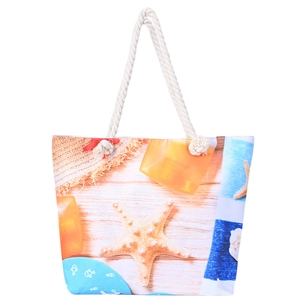 Détail du sac de plage avec poignées en corde de coton et toile imprimée d'étoiles de mer