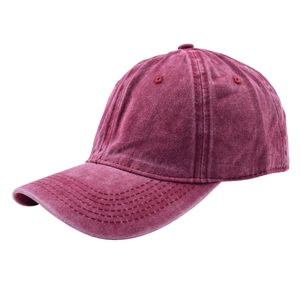 Detail of burgundy washed cotton baseball cap showing vintage texture and 6-panel structure