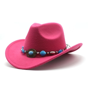 Detailed view of pink cowboy hat with decorative turquoise beads and vintage metal discs