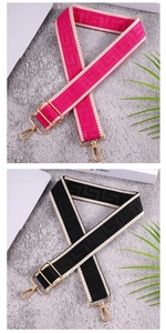 Detail of adjustable ethnic style wide bag straps with gold buckles in black and rose red