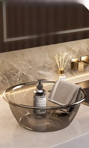 Detail of high-end translucent gray washbasin made of thickened tempered PET material