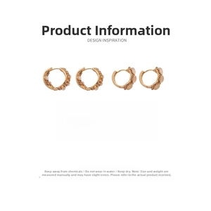 Détail de boucles d'oreilles dorées géométriques avec œil de chat et strass marron