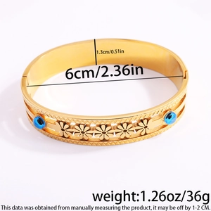 Detail showing dimensions and weight of the gold evil eye steel bangle with flower motifs