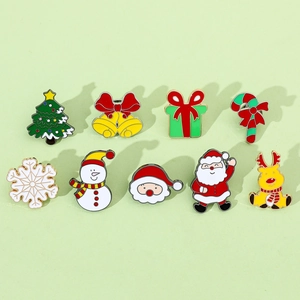 Detailed flat lay of 9-piece Christmas enamel brooch set with reindeer and snowman designs