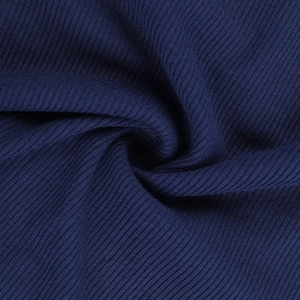 Macro detail of dark blue ribbed knit fabric showing vertical texture and soft material