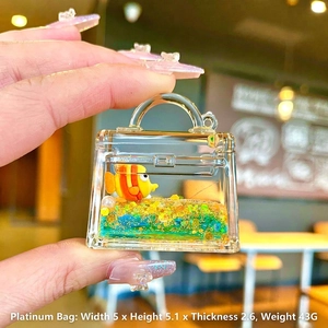 Mini acrylic Kelly-style bag pendant with clownfish floating inside, size 5x5.1x2.6cm