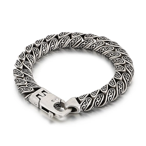 Vintage silver titanium steel bracelet with floral carvings and a spring clasp closure