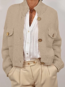 Women's beige chunky knit cardigan with wood buttons and front pockets for fall