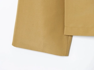 Close-up of khaki twill fabric texture and professional stitching on casual windbreaker