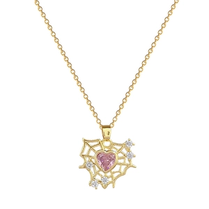 Gold spider web necklace featuring a pink heart stone and sparkling crystals on fine chain
