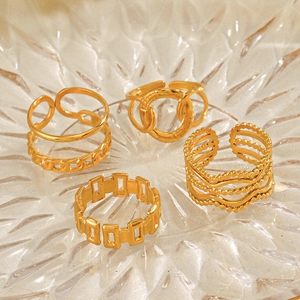 Set of four gold plated stainless steel rings featuring geometric and chain designs