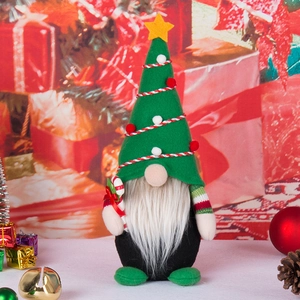 Handmade Christmas gnome plush toy with green star hat and candy cane decoration