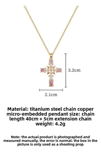 Detail of gold titanium cross necklace with pink zircon and white pearl accents