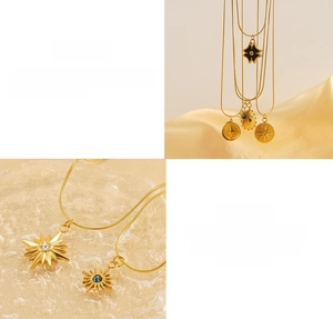 Detail view of gold stainless steel tarot pendants featuring sun star and compass designs