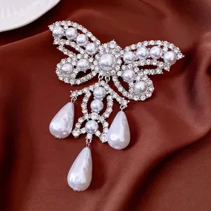 Vintage butterfly brooch with sparkling crystals, pearls and hanging water-drop pendants