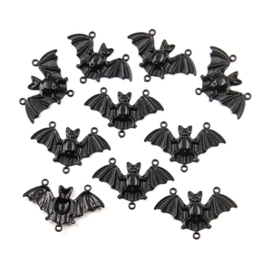 Detailed view of ten black electrophoretic bat pendants with wing textures for DIY jewelry