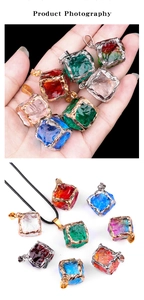 Detailed close-up showing various colors of cube crystal pendants with metal edging