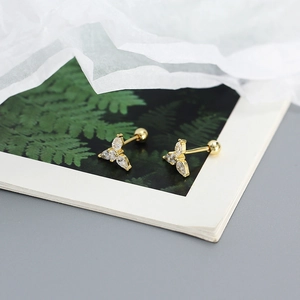 Detailed macro view of gold-plated S925 silver stud earrings with marquise-cut zircons