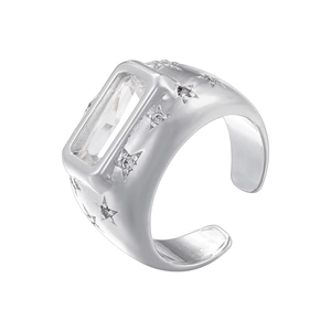 Detailed macro of silver star ring featuring rectangular crystal and adjustable open band