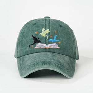 Vintage green washed cotton baseball cap featuring embroidered flying dragons and book design