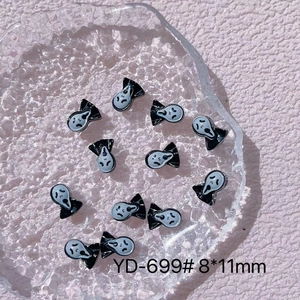 Detail of Scream Ghostface nail charms in black and white resin, size 8x11mm