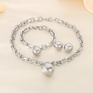 Three-piece stainless steel jewelry set featuring chunky chain necklace, bracelet, and ball studs