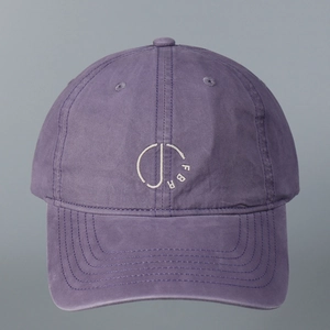 Close-up of FBR logo embroidery on purple washed cotton vintage baseball cap
