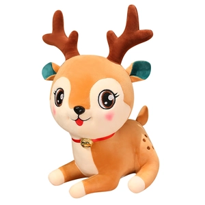 Cute brown plush reindeer stuffed animal with red bell collar on white background