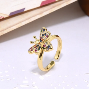 Macro detail of 18k gold bee ring featuring colorful zircon micro-inlay accents