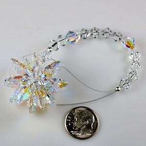 Rainbow crystal snowflake ornament suncatcher with beads and coin for size reference
