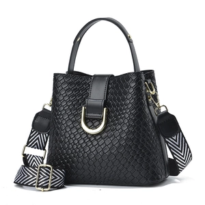 Black woven leather bucket bag with adjustable geometric patterned wide shoulder strap