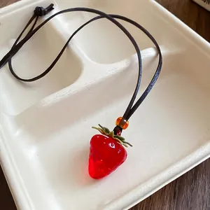 Handmade red resin strawberry pendant necklace with green leaf and brown leather cord