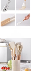 Detail of 7-piece silicone kitchen utensil set with natural wooden handles in cream white