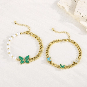 Vintage gold-tone butterfly chain bracelet with pearls and green enamel charms
